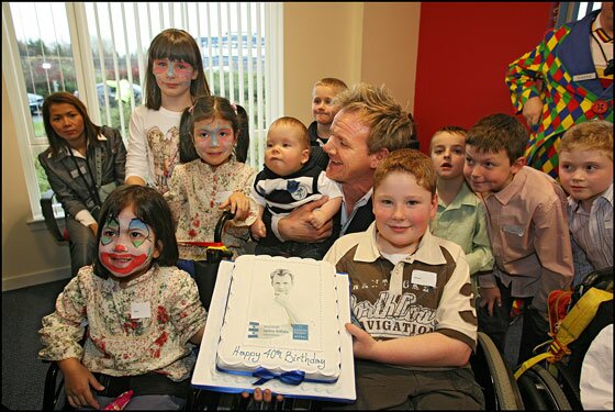 Children present Gordon with 40th Birthday Cake